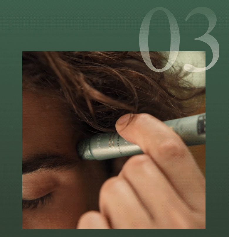 Close-up of finger applying serum near eye area