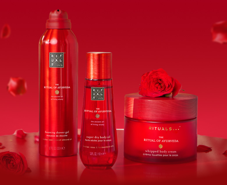 Woman in a red dress representing The Ritual of Ayurveda collection.
