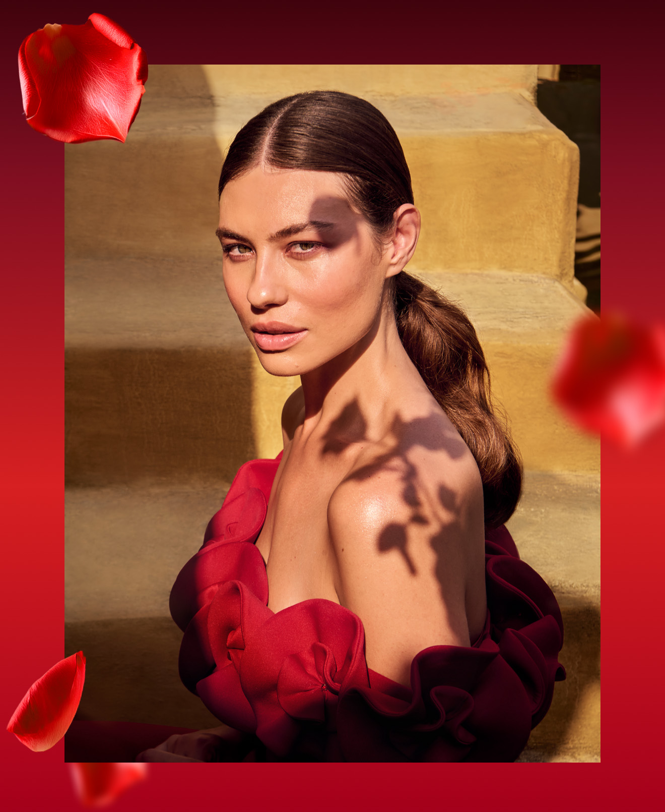 Woman in a red dress representing The Ritual of Ayurveda collection.